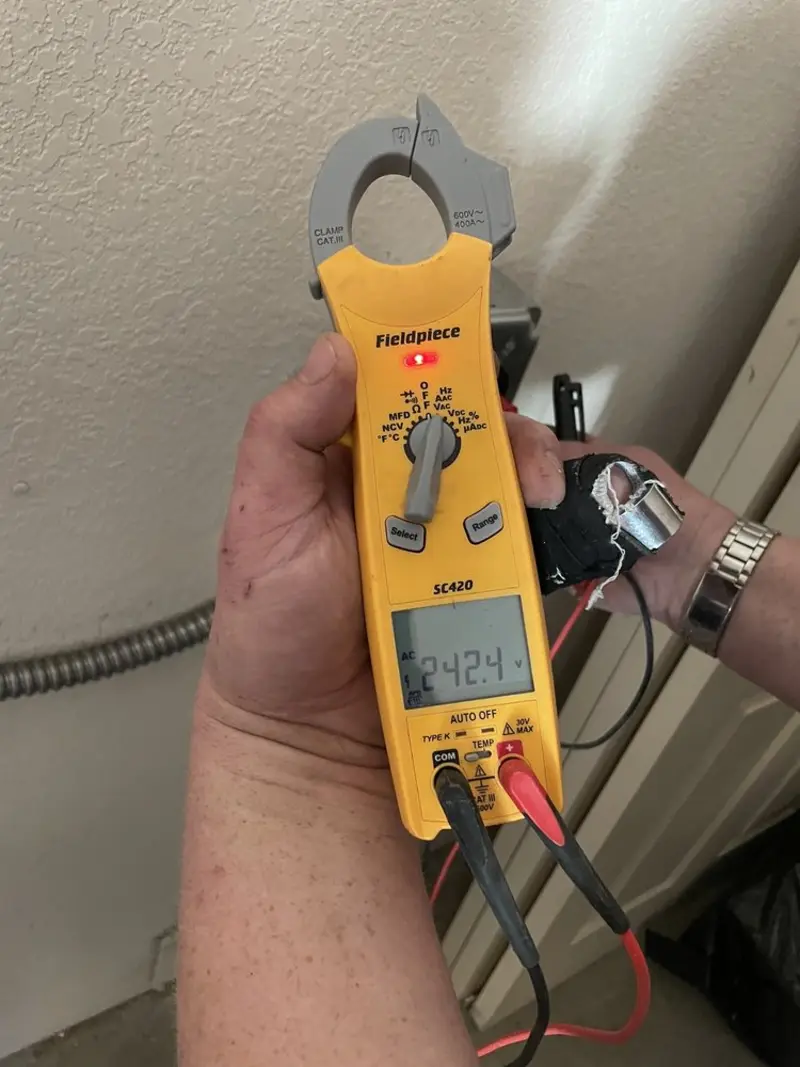 Voltage testing with clamp meter during Electrical Installation Services in Crane